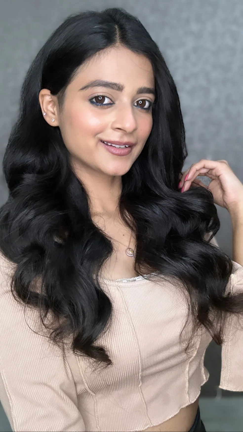 Lavanya Bagga smiling, with flowing dark hair